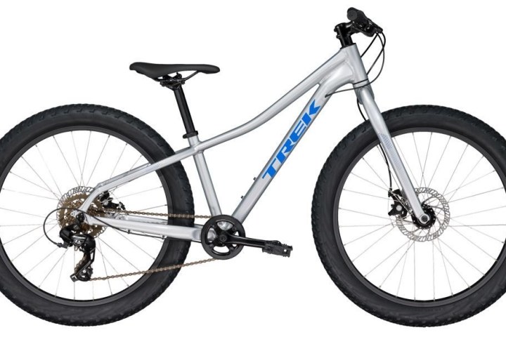 Silver mountain bike with thick tires and blue logo.